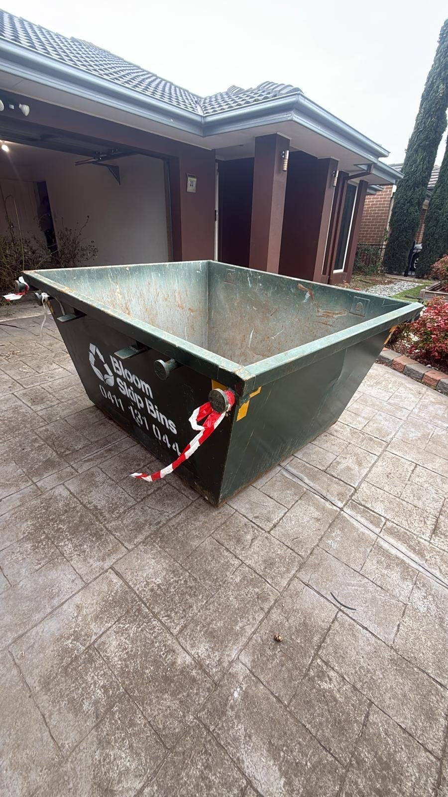 Bloom Skip Bins 2m³ mini skip bin on a driveway in Melbourne