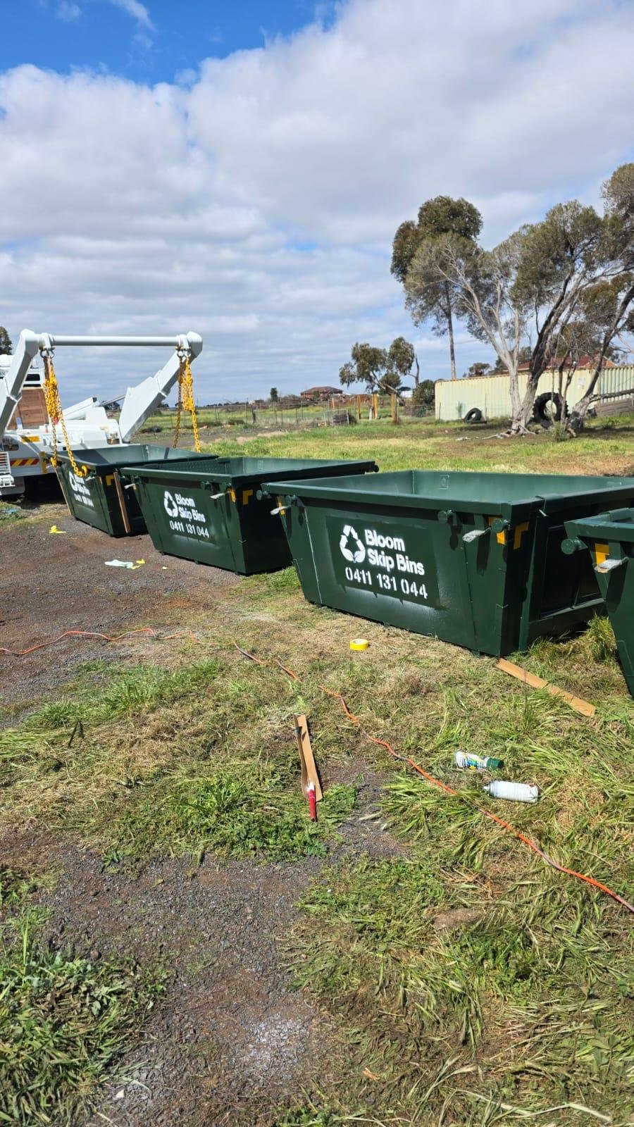 Bloom Skip Bins truck lifting a skip bin in Melbourne