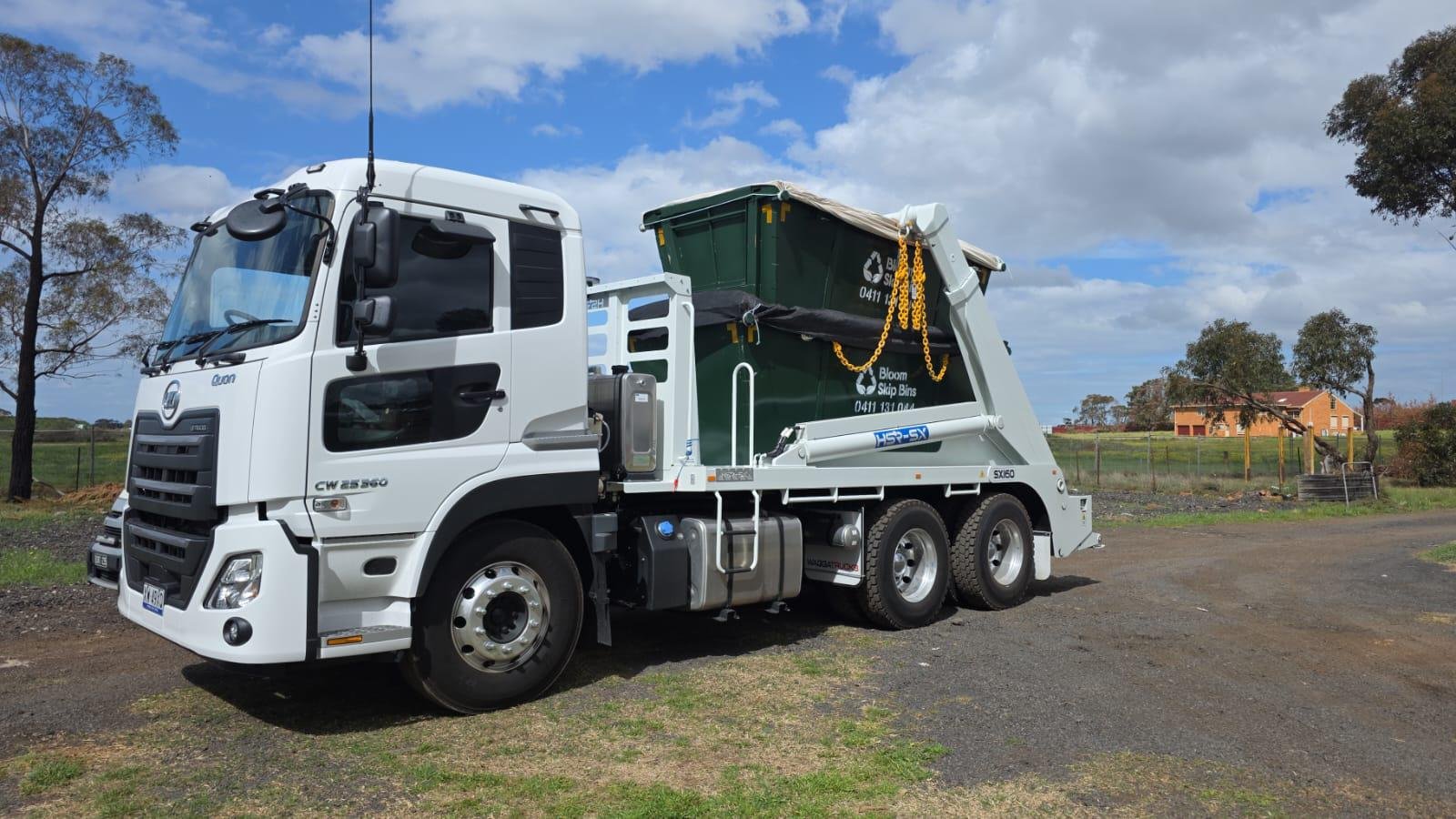 Bloom Skip Bins truck delivering a skip bin in Melbourne's west